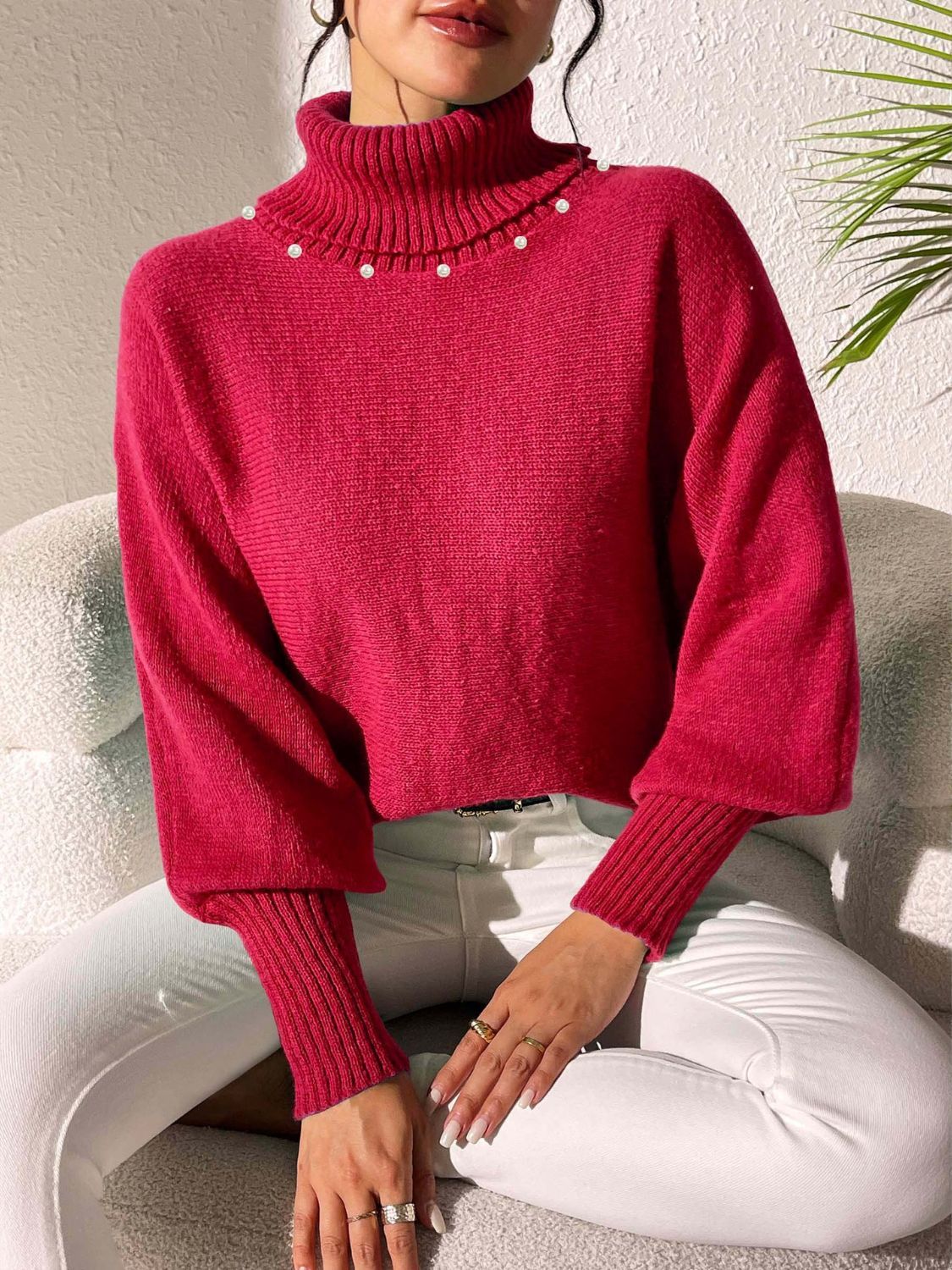 Deep Red knit sweater with turtleneck and pearl embellishments on collar, dolman sleeves.