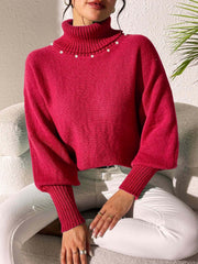 Deep Red knit sweater with turtleneck and pearl embellishments on collar, dolman sleeves.
