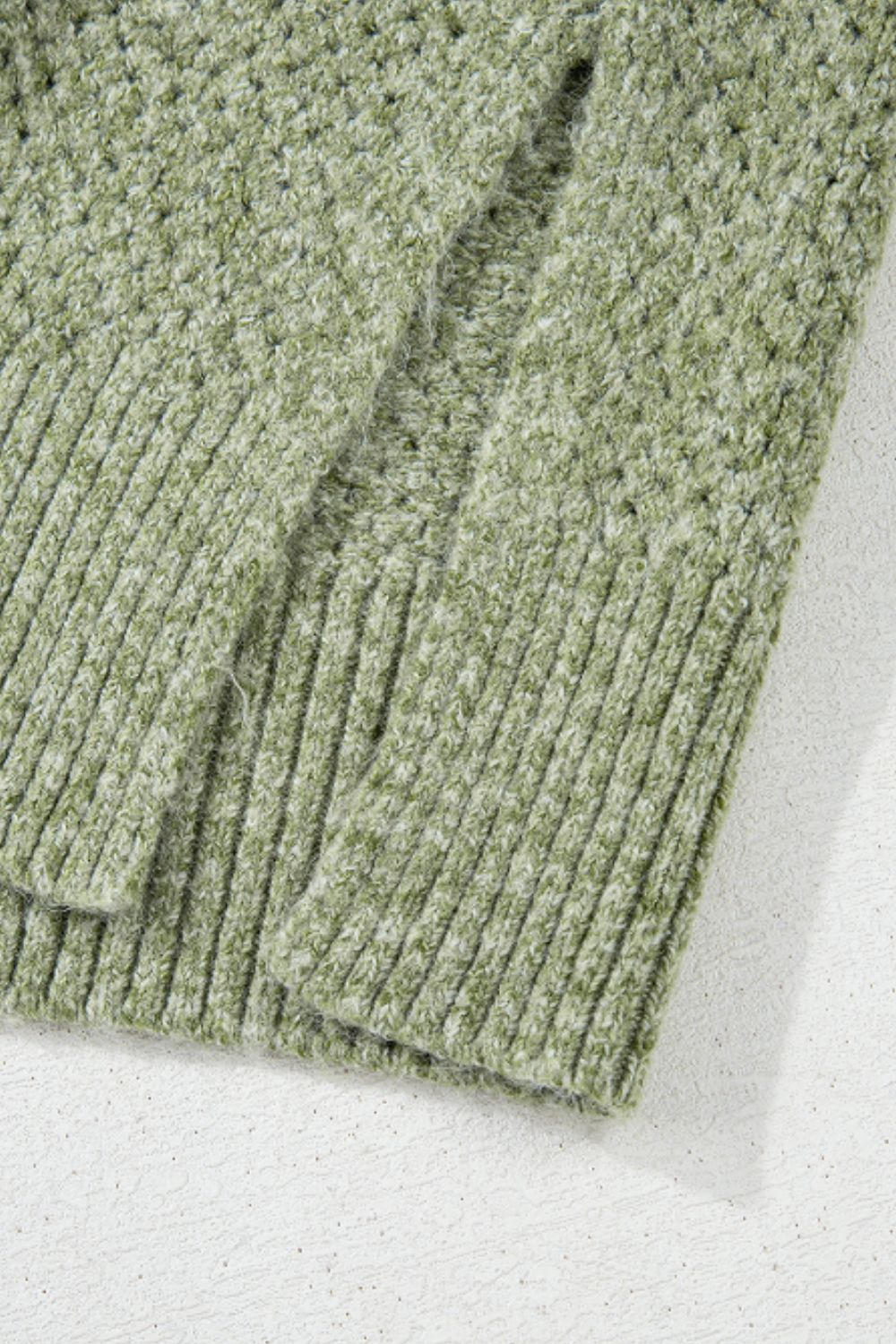 Open-knit slouchy V-neck sweater in matcha green with ribbed cuffs and hem