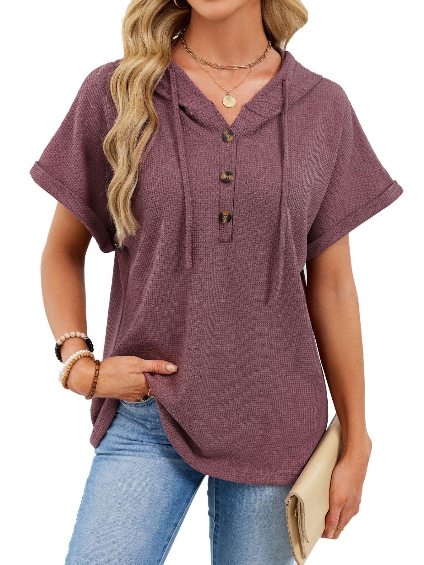 Waffle knit short sleeve hooded top in brick red with button placket and drawstring.