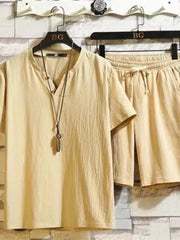 Khaki cotton two-piece set with henley neckline shirt and drawstring shorts.