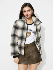 Plaid puffer jacket in gray with a stand-up collar and zip closure.