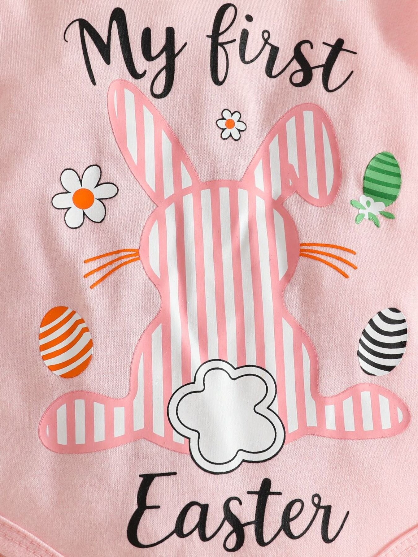 Pink baby bodysuit with striped bunny, Easter eggs, flowers, and text.
