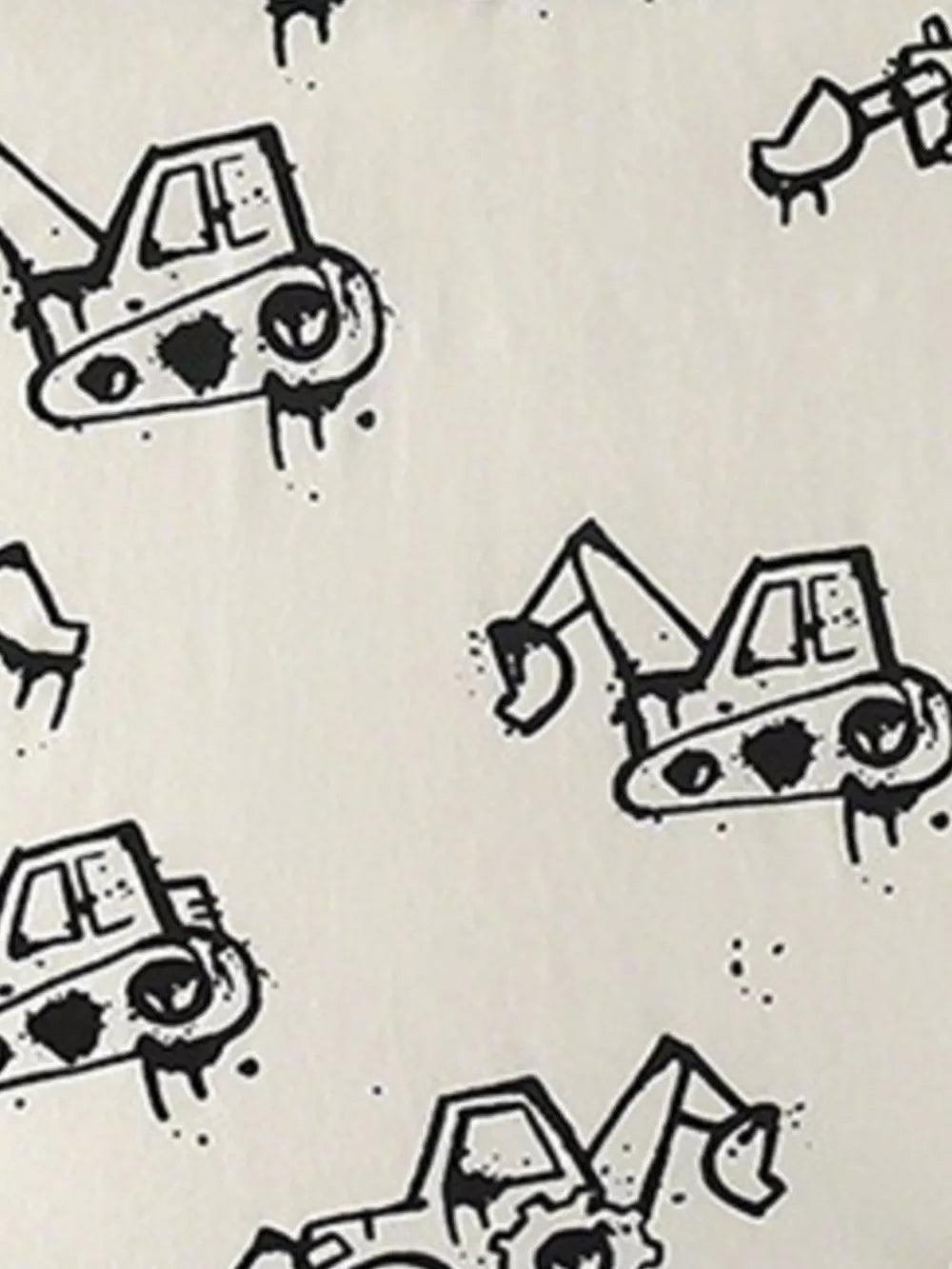 Toddler t-shirt with a playful black excavator print on a cream cotton background.