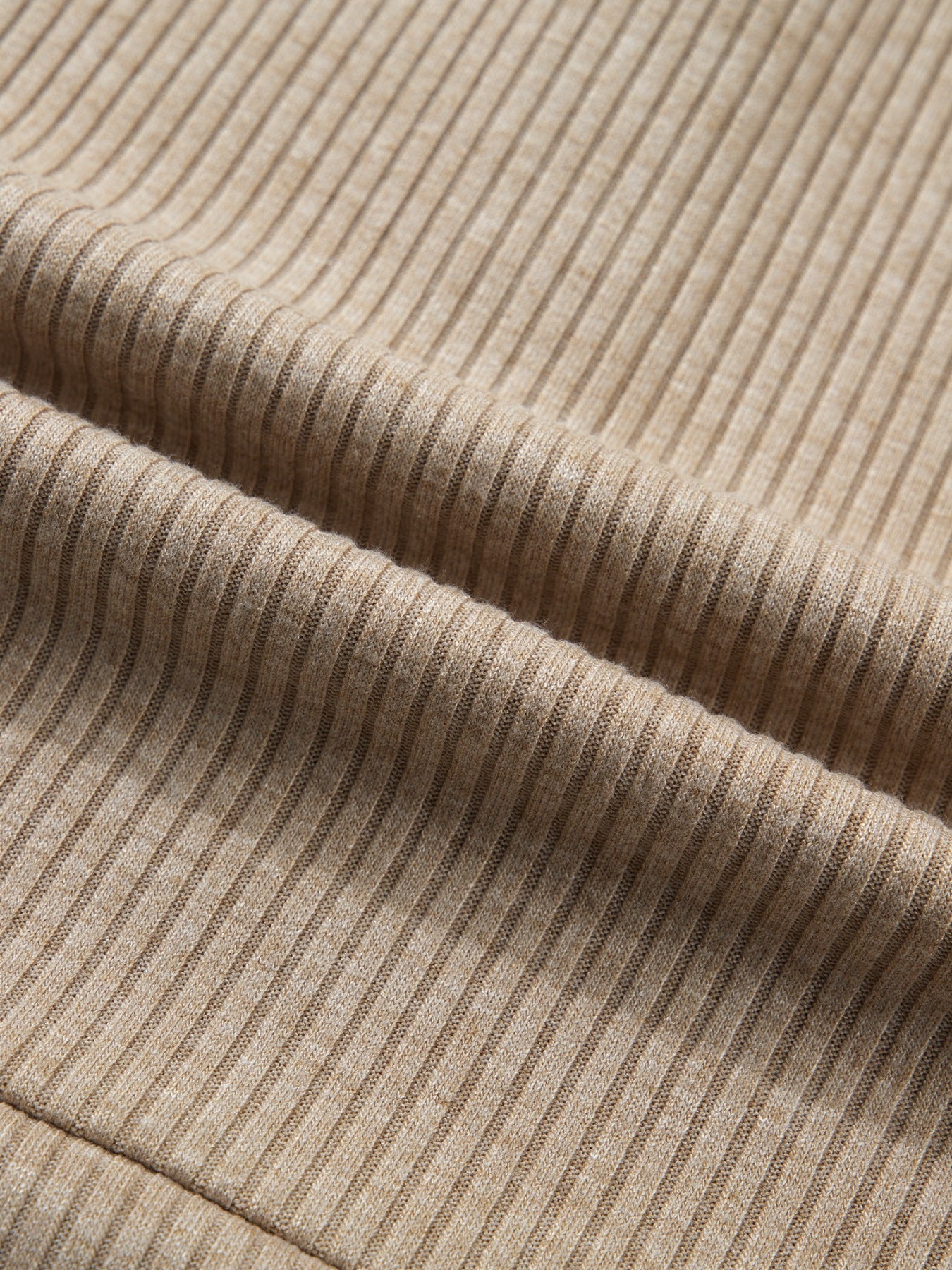 Cozy ribbed knit maternity shirt in beige with subtle denim accents.
