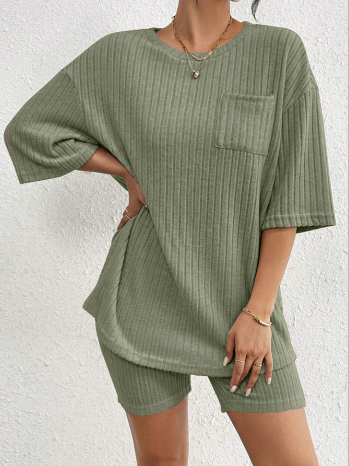 Sage ribbed loungewear set with a pocket tee and biker shorts.