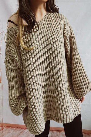 Oversized mocha ribbed knit sweater with boat neck and balloon sleeves.