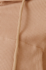 Waffle knit cropped zip hoodie in khaki with drawstring and pocket detail.