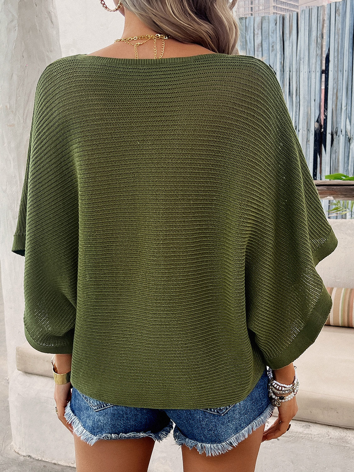 Open-knit dolman sleeve sweater in matcha green with a V-neckline.