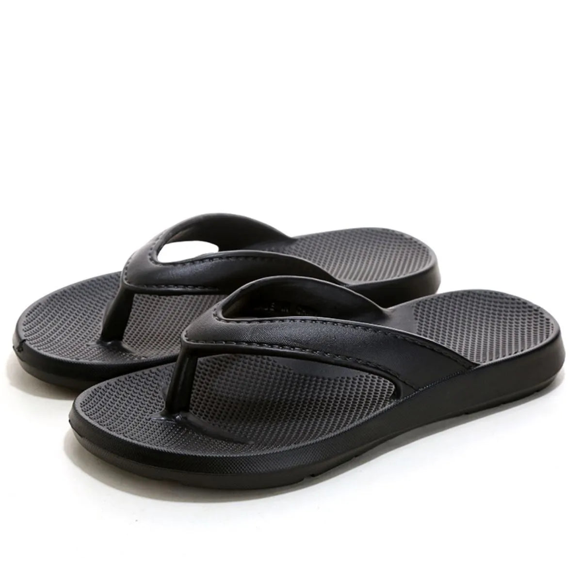 Black textured rubber thong sandals with a waffle-patterned footbed.