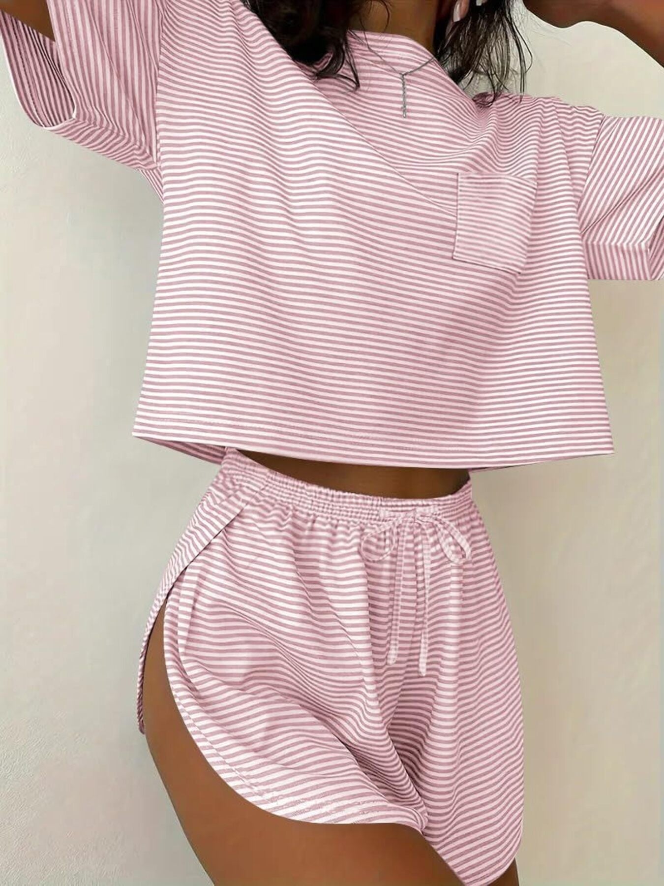 Pink striped pajama set with crop top and drawstring shorts