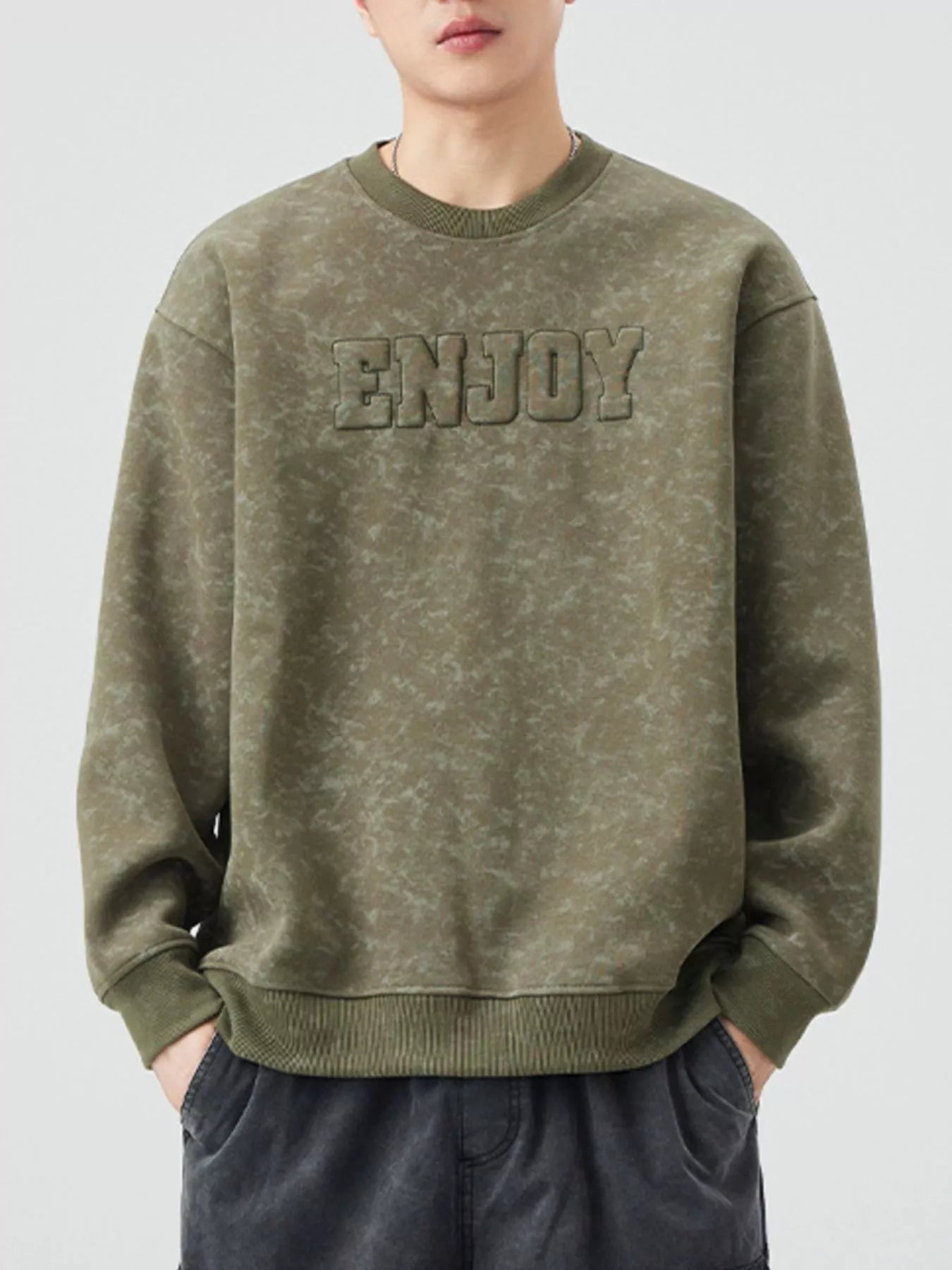 Men's Army Green long-sleeve sweatshirt with textured "ENJOY" graphic and marbled pattern.