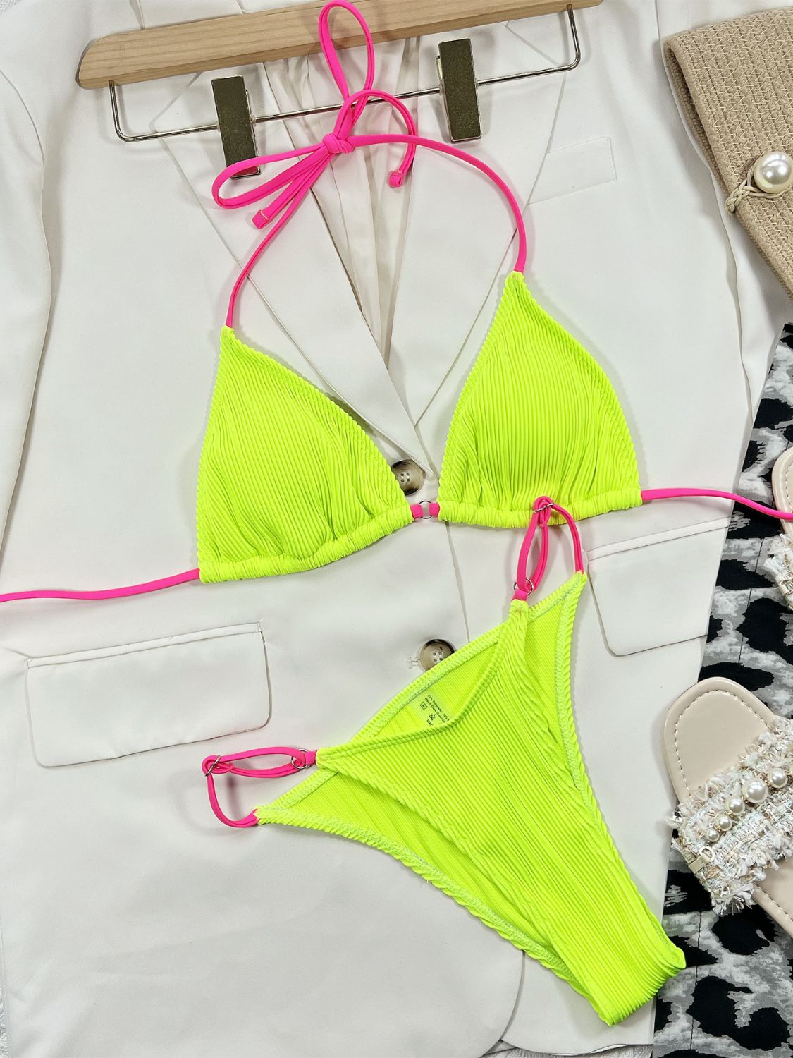 Neon ribbed triangle bikini set with pink ties, shown with a white blazer.