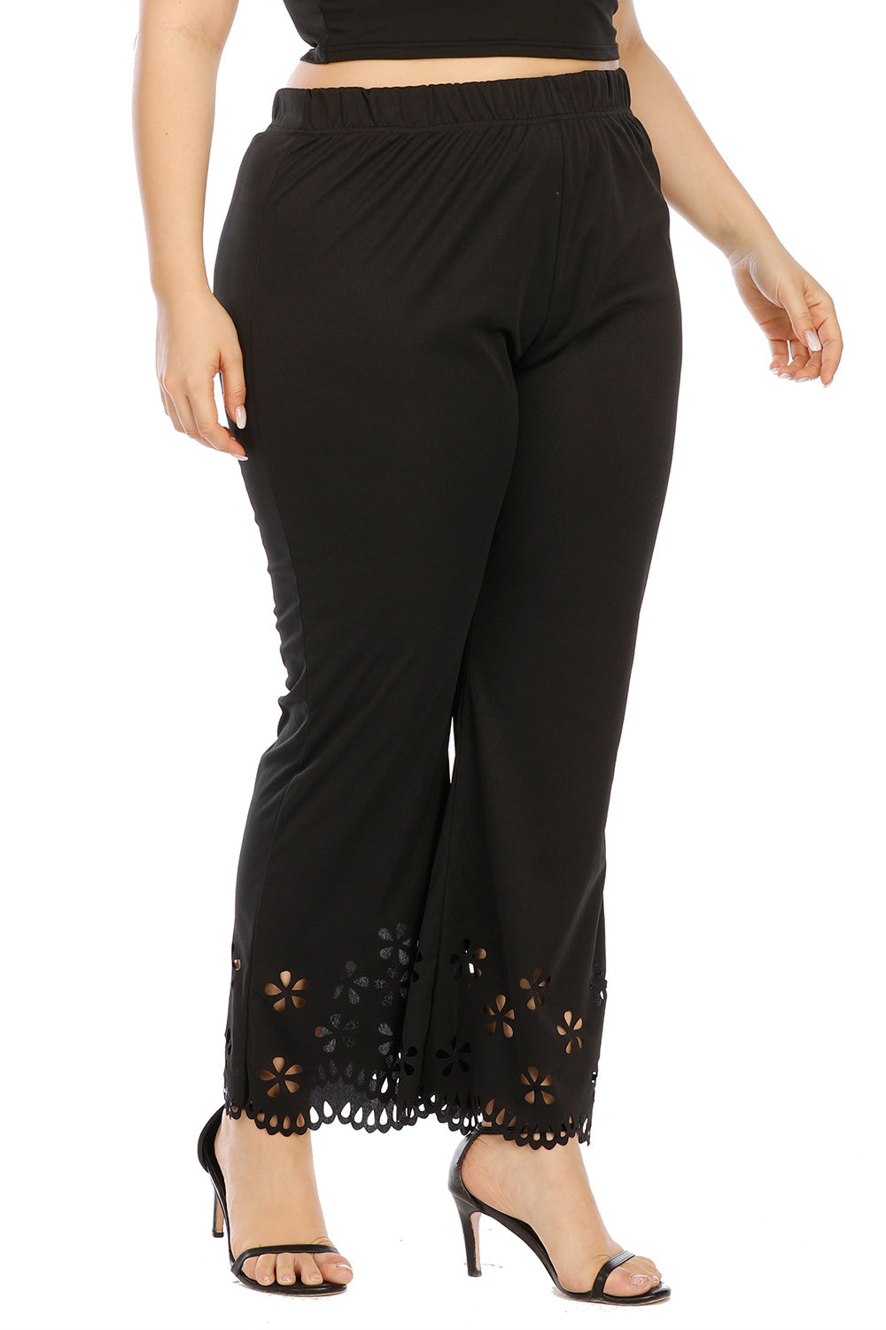 Black flare trousers with floral cutout hemline detail