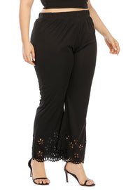 Black flare trousers with floral cutout hemline detail