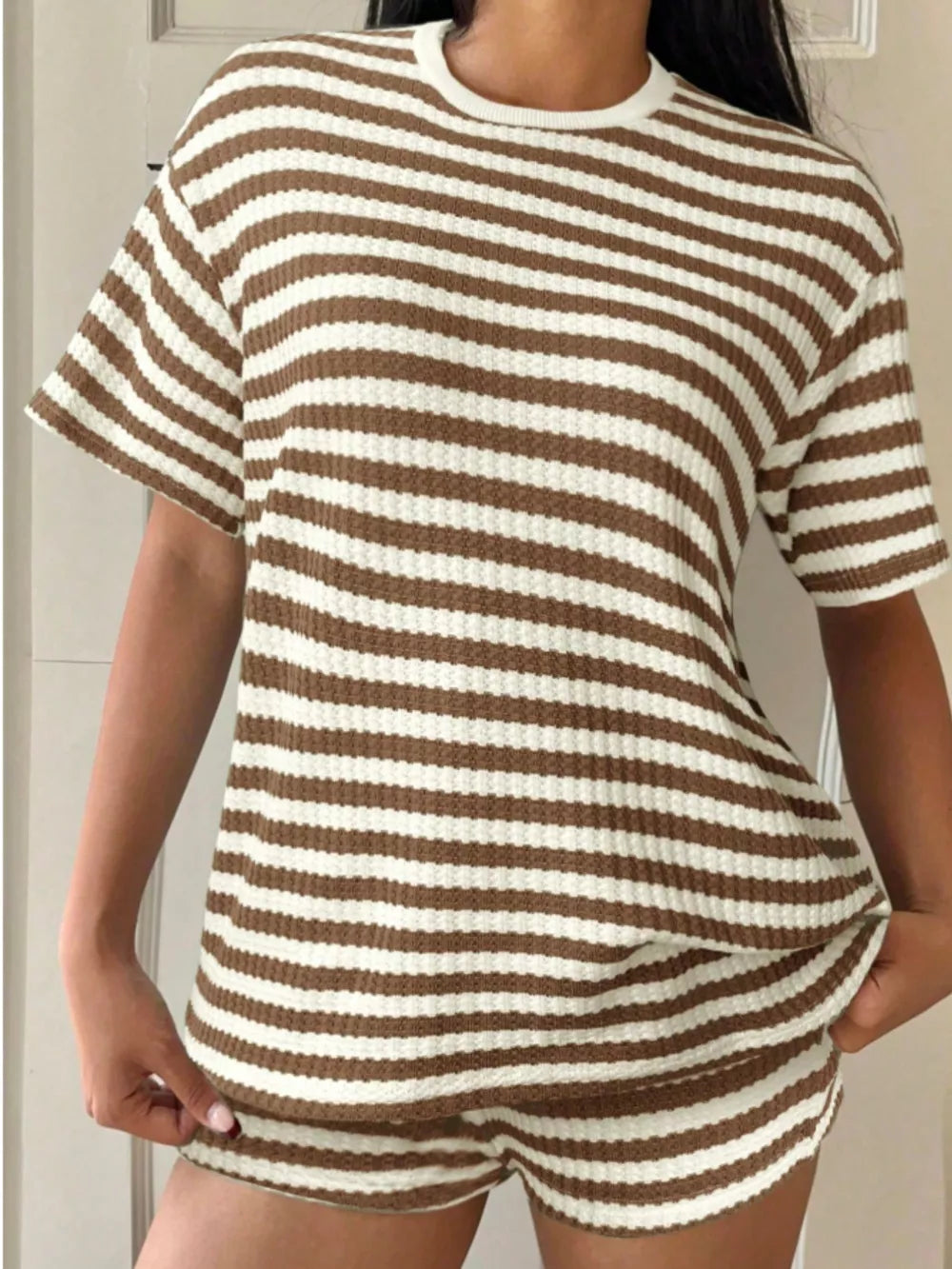 Brown and white striped waffle knit loungewear set with crew neck top and shorts.