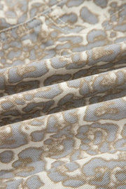 Denim shorts with a subtle grey and tan leopard print pattern.