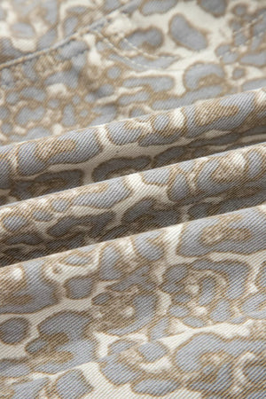 Denim shorts with a subtle grey and tan leopard print pattern.