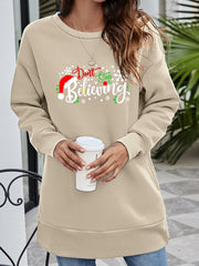 Beige crewneck sweatshirt with "Don't Stop Believing" holiday graphic and Santa hat detail.