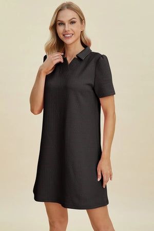 Black textured V-neck short sleeve mini dress with geometric pattern
