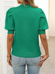 Green knit sweater with mock neck and puff sleeves, ribbed cuffs and hem