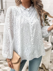 White eyelet embroidered blouse with ruffle collar and button front.