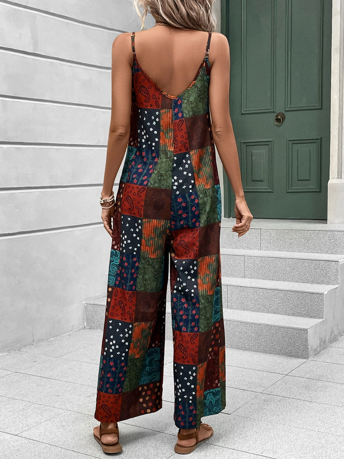 Multicolor patchwork print cami jumpsuit with wide legs and button detail.