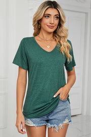 Heathered dark green v-neck t-shirt with short sleeves, styled with denim shorts.