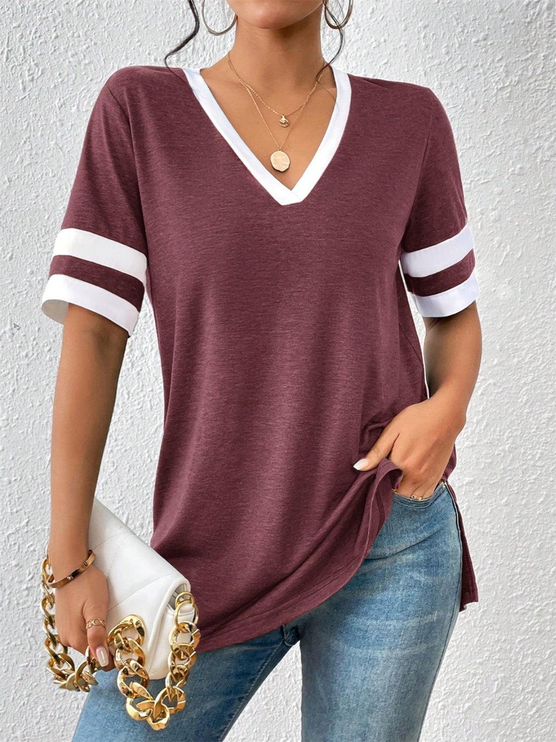 Plum v-neck t-shirt with white contrast trim on neckline and sleeves.