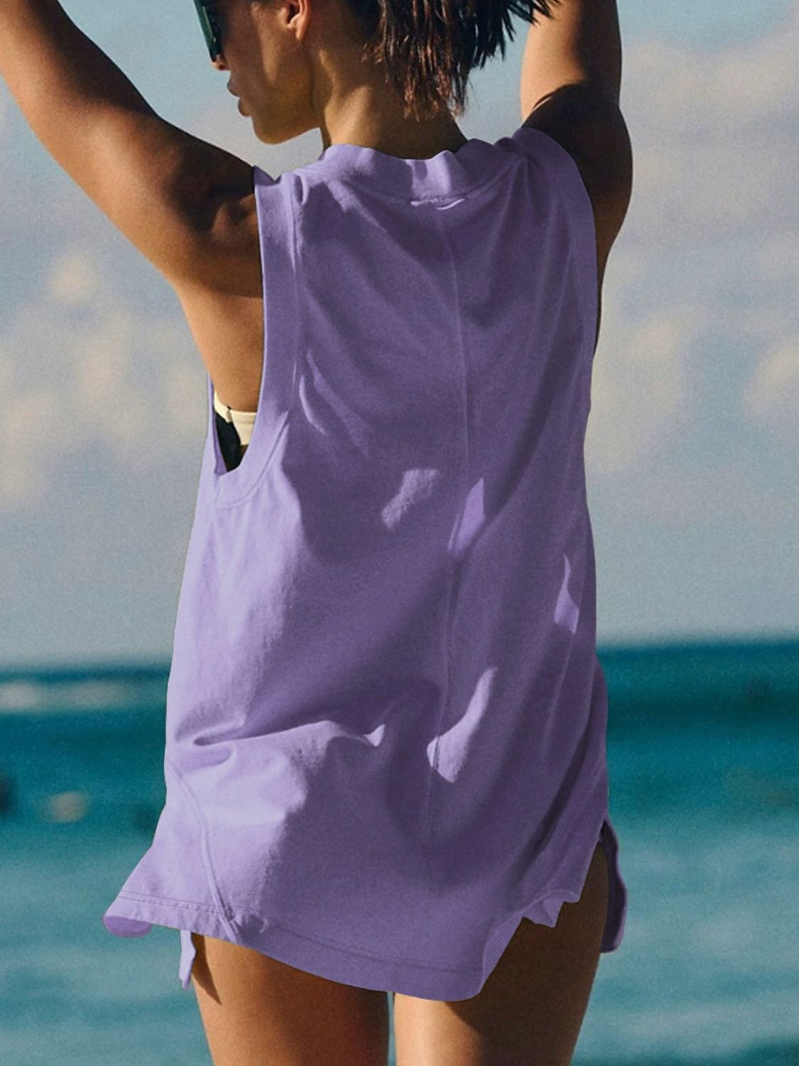 Lavender wrap-front pocket tank top with a relaxed fit and side slits.