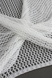 White crochet blouse with open knit detail and pearl chain accent