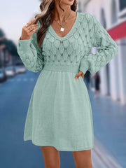 Teal openwork knit V-neck sweater dress with cinched waist and above-knee length.