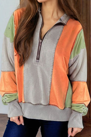 Panelled zip-up sweatshirt in gray with orange and green colorblock and contrast stitching.