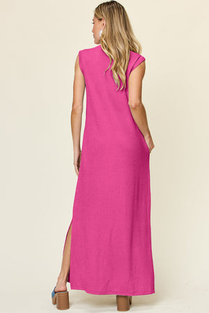 Textured ribbed maxi dress in hot pink with cap sleeves and side slits.