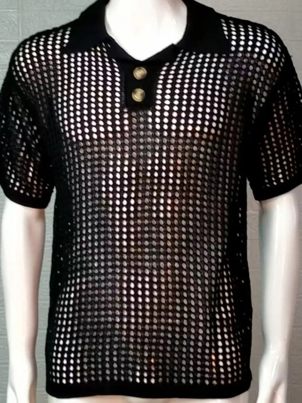 Black open-knit polo shirt with pointed collar and two button placket.