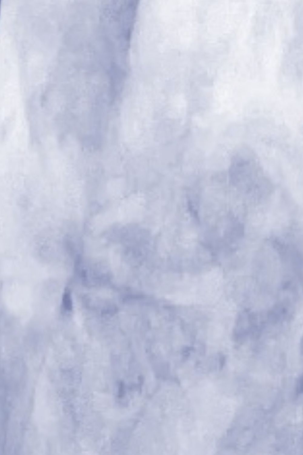 Cloud Wash Overshirt in Misty Blue with patch pockets and a tie-dye effect.
