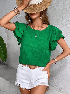Green textured smocked blouse with ruffle sleeves and a round neckline.