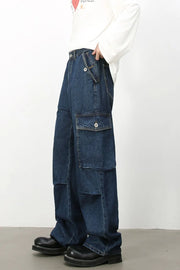 Denim palazzo cargo pants in dark wash with multiple pockets and a baggy fit.