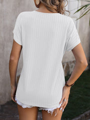 White textured V-neck tee with short sleeves and a casual fit.