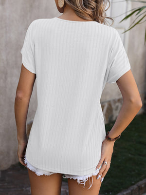 White textured V-neck tee with short sleeves and a casual fit.