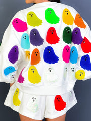 White loungewear set with multicolor ghost appliqués on sweatshirt and shorts.