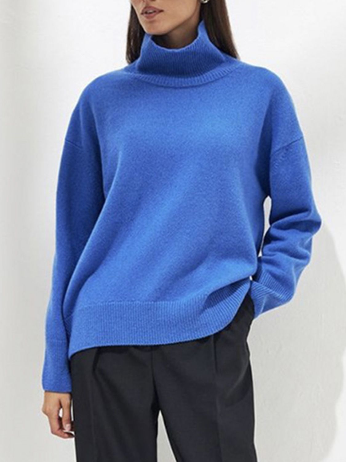Relaxed fit royal blue ribbed turtleneck knit sweater with long sleeves and a relaxed cut.