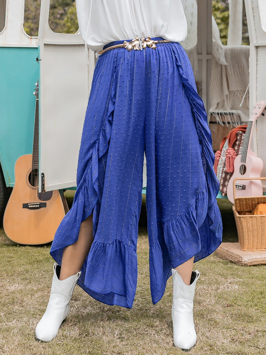 Azure ruffle overlay palazzo trousers in royal blue with a textured dot pattern and metallic stripes.