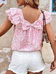 Pink floral ruffle blouse with back bow detail and flutter sleeves.