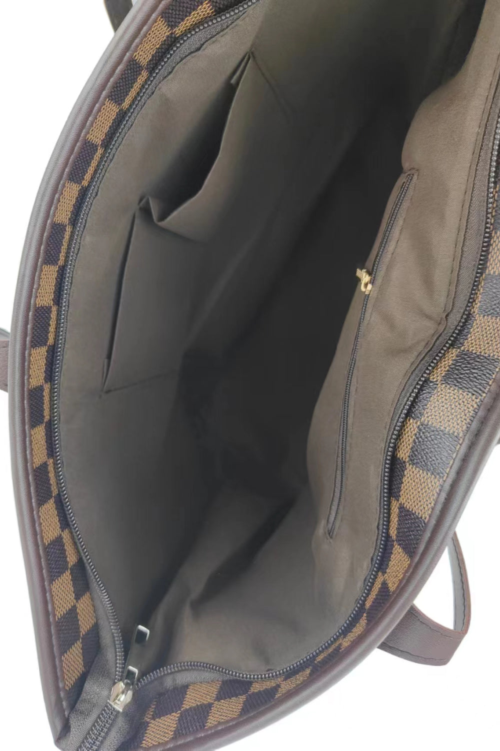 Damier tote bag interior with checkerboard pattern and multiple pockets.