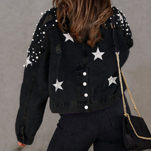 Black denim jacket with pearl and star embellishments
