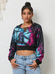 Multicolor tie-dye crop hoodie with lace-up neckline and black cuffs.