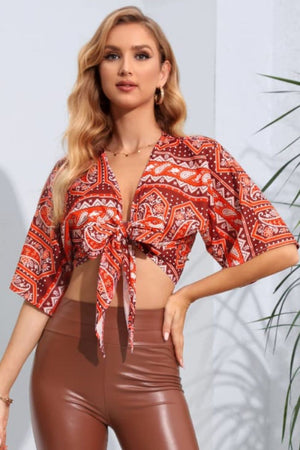Paisley print knot-front crop blouse with flutter sleeves in multicolor.