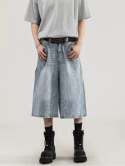 Men's light wash denim relaxed fit wide-leg capris with cargo pockets and a raw hem.