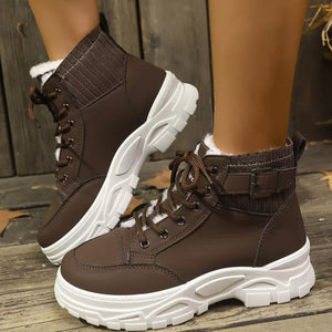 Chocolate lace-up boots with plush accents and buckle detail.